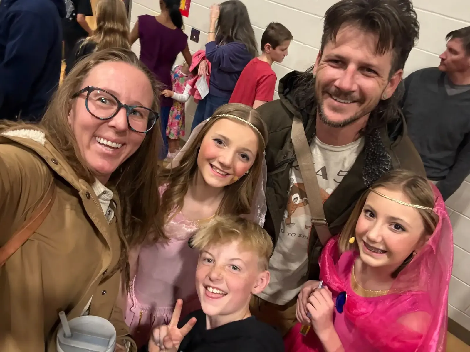Jake's family smiling together in a group selfie